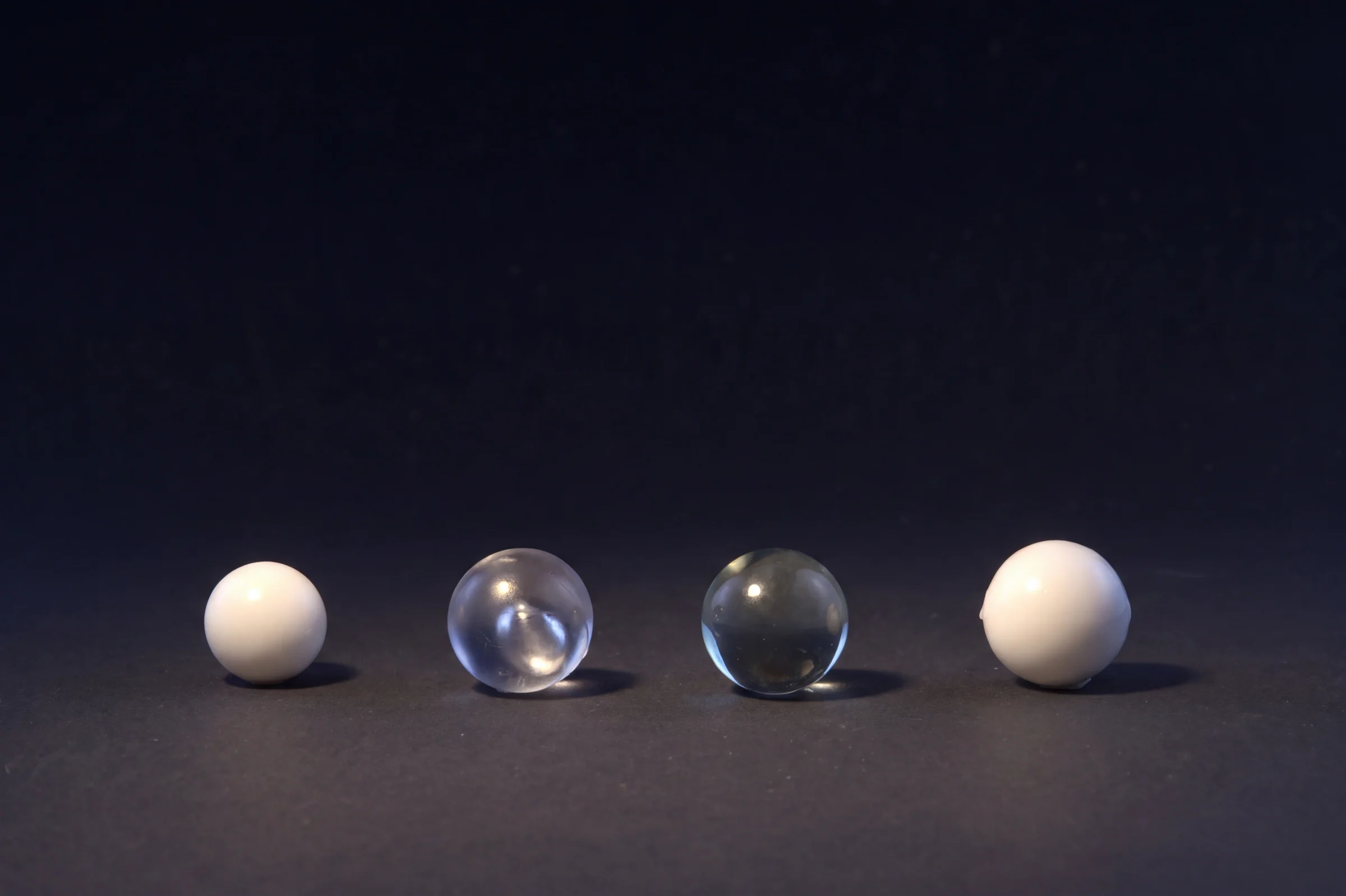 Plastic balls (white) and glass balls (clear) for Crown pourers
